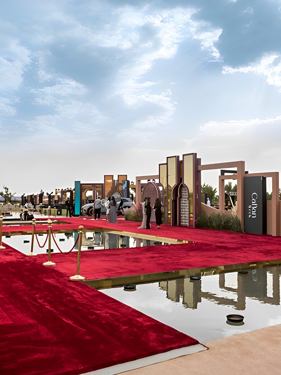 Caftan Week event setting in Marrakech with a red carpet and reflecting pools