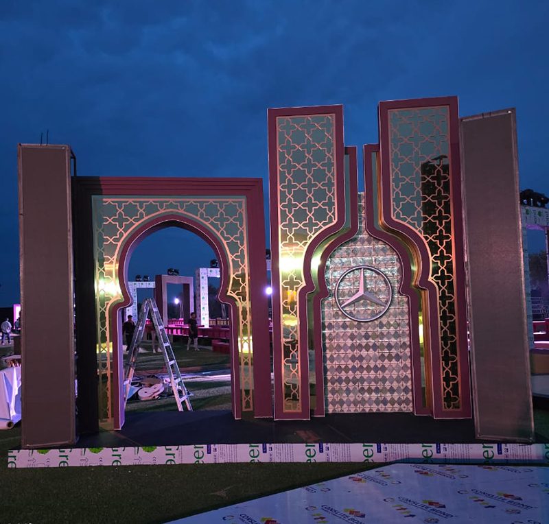 The Mercedes-Benz arches and star at dusk during installation